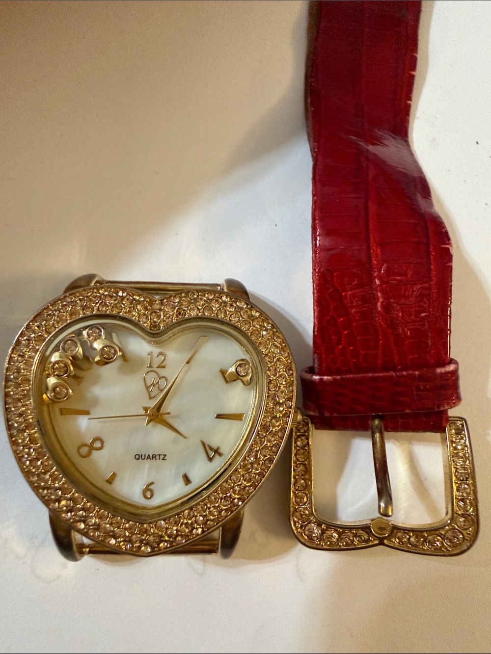 Gold Heart Crystal Quartz Watch with moving little sparkling hearts inside.
